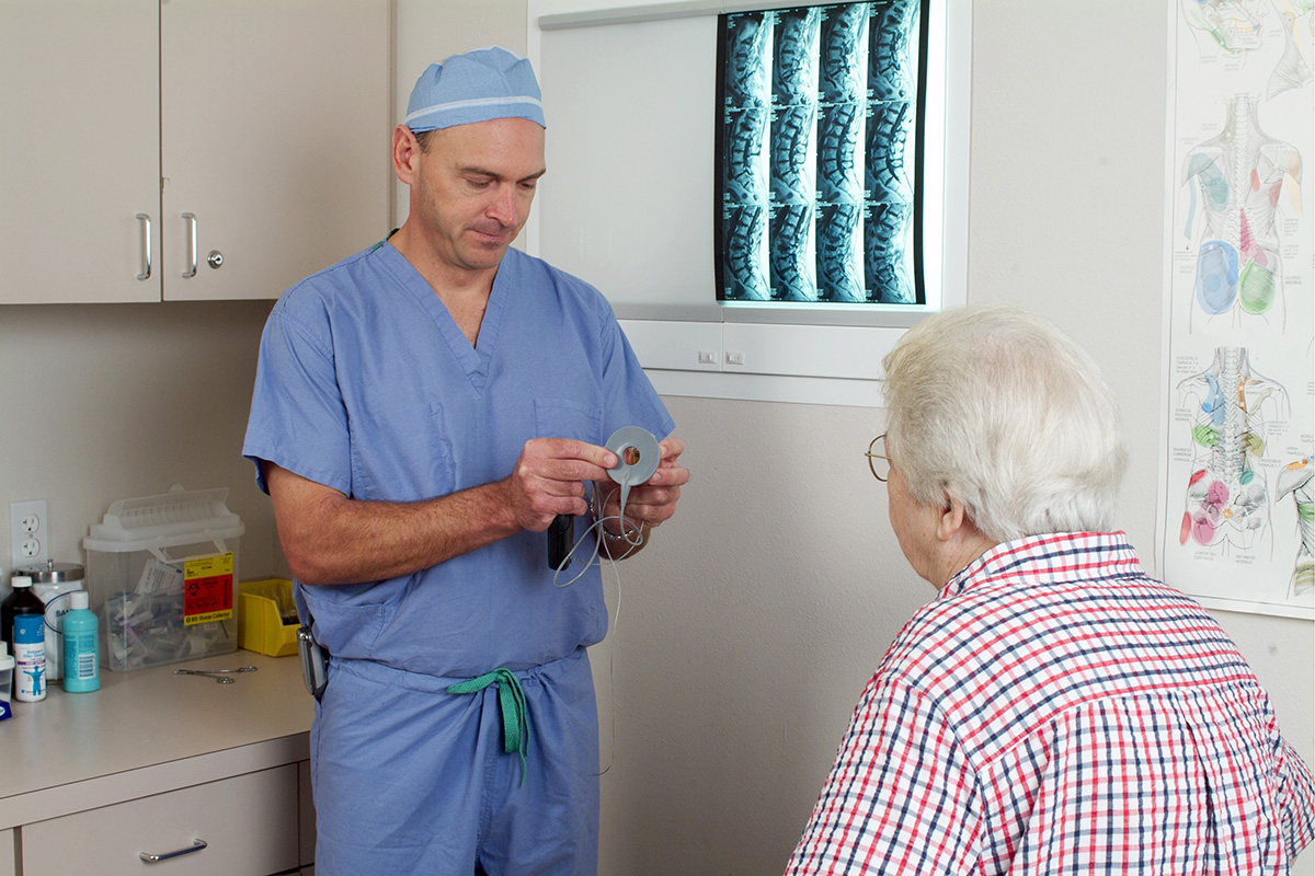 Doctor demonstrating stimulator