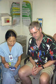 Patient is shown how to use DBS controller